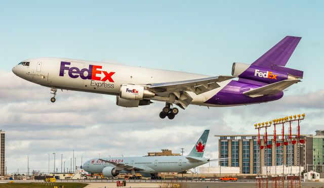 McDonnell Douglas DC-10 (N562FE) - A pretty rare occurrence here as FEDEX Express DC-10 lands on runway 24R. Now she has to taxi all the way across the airport to the FEDEX ramp which is just off runway 23. Runway 23 was closed this morning and ATC were very busy bringing in all the Saturday morning traffic in on the south runways.