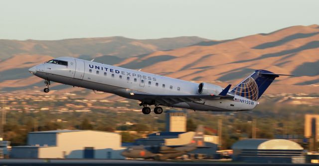 Canadair Regional Jet CRJ-200 (N915SW) - Early morning (sunrise) departure of SKW's N915SW.  In this photo, N915SW is still dressed in the United Express livery, which it no longer wears.  About 7 months ago, N915SW was repainted and now wears the new SkyWest Charter * livery.  br /* See COMMENT below.