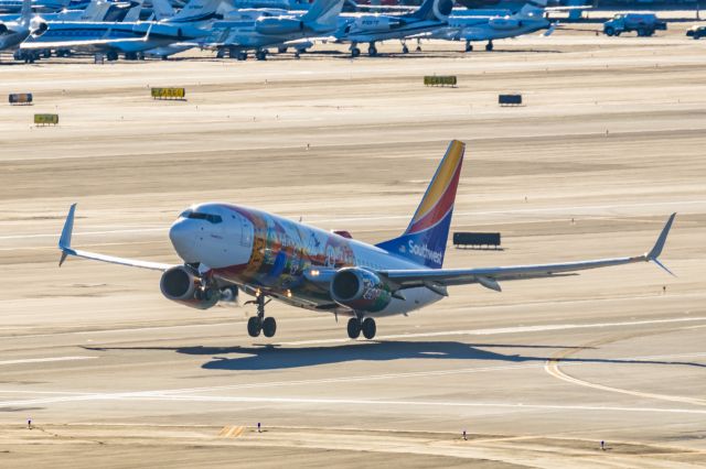 Boeing 737-700 (N945WN) - A Southwest Airlines 737-700 in Florida One special livery taking off from PHX on 2/12/23 during the Super Bowl rush. Taken with a Canon R7 and Canon EF 100-400 II L lens.