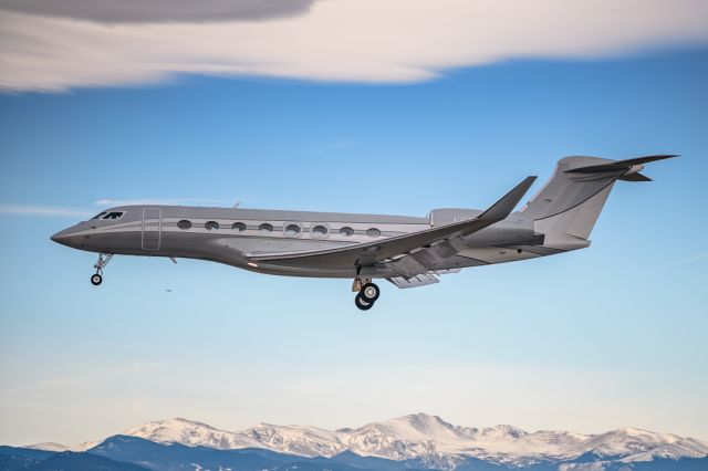 Gulfstream Aerospace Gulfstream G650 (N650NR) - This airplane showed up like a ghost, no tracking data, no public flightplan, just a call to tower when he was switched from approach. It also does well looking like a ghost painted against the Rocky Mountains.br /br /©Bo Ryan Photography | IG: BoRyanFlies