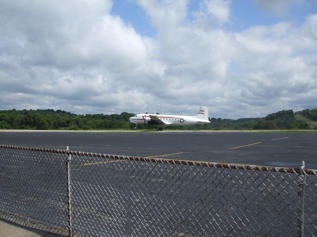 Douglas C-54 Skymaster (N500EJ) - Douglas C-54 (Spirit of Freedom): On runway 27 takeoff roll at Washington County.  Picture snapped just as the pilot begins the rotation.  Note: Aircraft used in Berlin Airlift, currently operated and maintained by the Berlin Historical Aircraft Foundation.