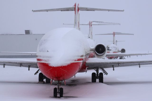 McDonnell Douglas DC-9-30 (XA-VBE) - Now… where is that snow brush? XA-VBE, XA-UZV, XA-UUT, and an Aeronaves TSM CRJ covered in snow on the ramp on 3 Feb 2022.