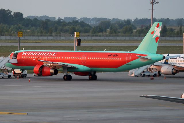 Airbus A321 (UR-WRI) - Parked by the terminal.