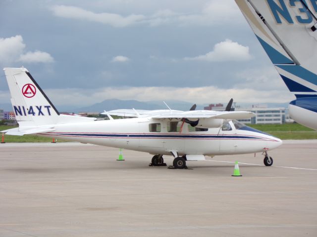 Partenavia P-68 (N14XT) - Taken from that road with the black fence. The tail seen is a Citation Jet's tail. Never heard of a SPA P68, though.