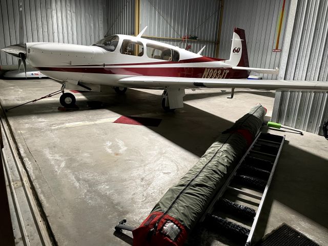 Mooney M-20 (N993JT) - 3JT sharing hangar space with a hang glider