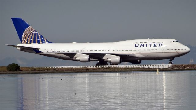 Boeing 747-400 (N104UA) - 20150306-141829.jpgbr /N104UA, Age: 17.2 Yearsbr /Boeing 747-400 (quad-jet) (H/B744/Q)br /Airline: United Airlines, Engines: 4x PW4000br /2015-03-06 UA857 San Francisco (SFO)-->Shanghai (PVG)