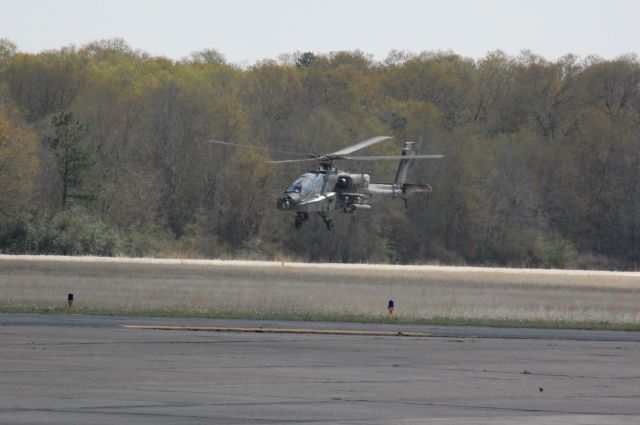 — — - AH-64D taking off from CXO.