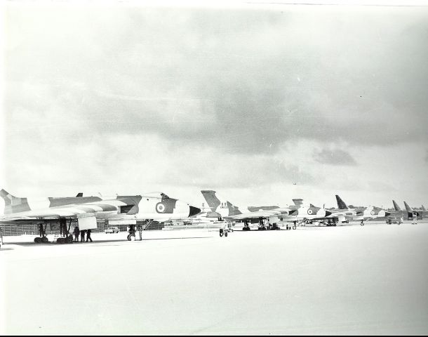 XM608 — - RAF Vulcans at Andersen AFB in transit to Singapore. Notice the night mission painted B-52Ds in the background.(1969)  R.F.