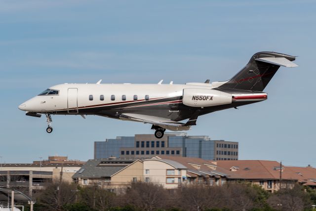 Bombardier Challenger 300 (N550FX) - Very gusty afternoon at Addison Airport.