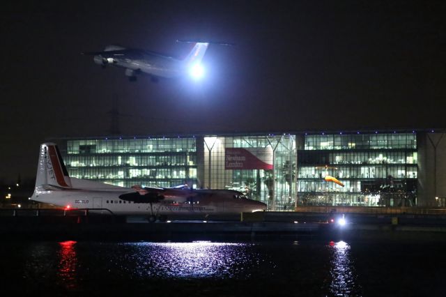 Fokker Maritime Enforcer (OO-VLO) - Cityjet F50 holds short of runway, as a Cityjet Bae-146 departs from LCA.