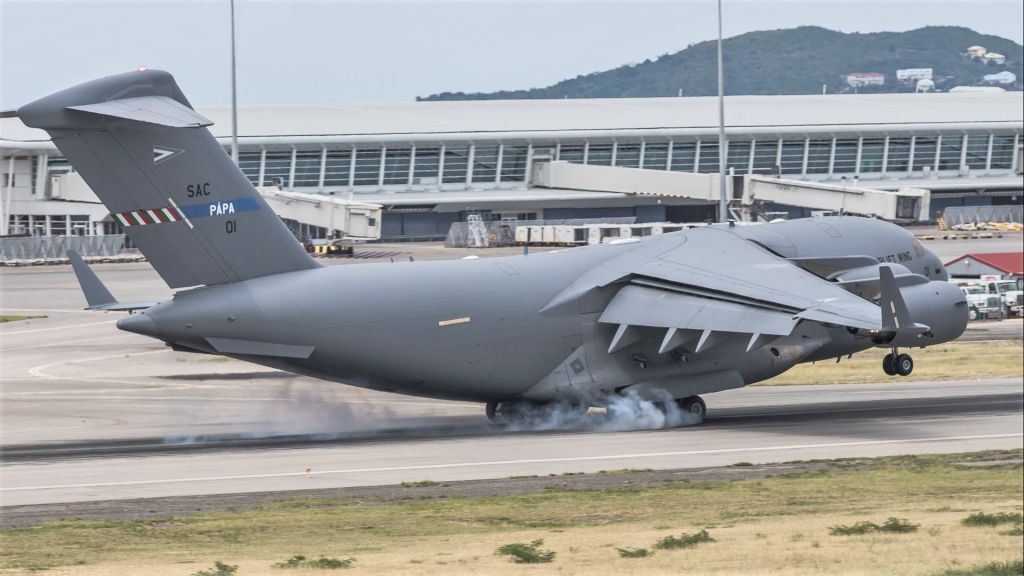 Boeing Globemaster III (08-0001) - Multi National Air force 08-0001 SAC heavy airlift wing C17 making positive contact while landing with supplies for the fight against COVID19 from Holland for the island's of St Maarten Saba and Statia.br /SAC01 on her first ever visit to St Maarten.br /05/04/2020