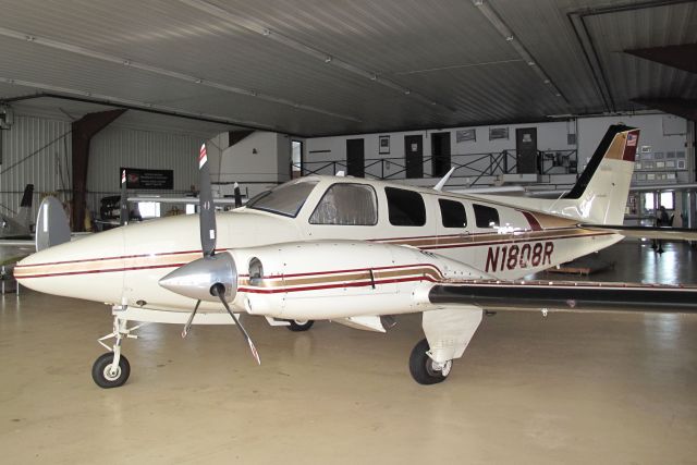 Beechcraft Baron (58) (N1808R) - A very powerful and rare pressurized 58 Baron. Note the main cabin door on the left side.