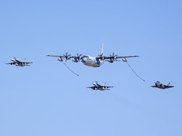 Lockheed EC-130J Hercules (16-7984) - RAIDR17, a KC-130J Hercules from MCAS Miramar demonstrating its’ aerial refueling capability with an FA-18C (165407), FA-18D (165415), and F-35B (169620) during the Yuma Air Show on 9 Mar 2024.