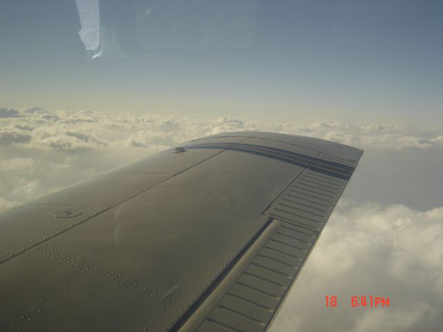 Piper Saratoga (N30082) - Flying high above the clouds on our way to Pueblo, CO