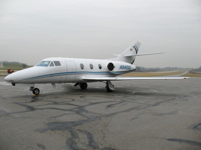 N840GL — - N840GL Falcon 10 business jet parked on the main flight ramp area on a rainy day at KTHV , York Airport