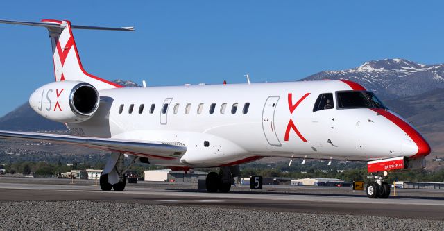 Embraer ERJ-135 (N268JX) - Taxiing north on Charlie to the Stellar Aviation ramp after a midmorning arrival from KLAS.