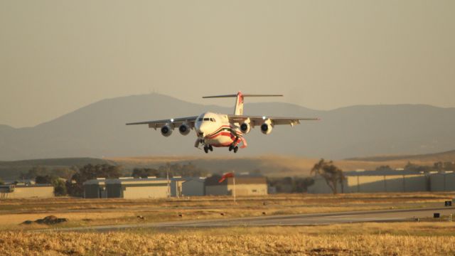 Avro Avroliner (RJ-85) (N839AC) - Aeroflite Tanker 160 heads out of PRB at sunset for the Crews Fire.