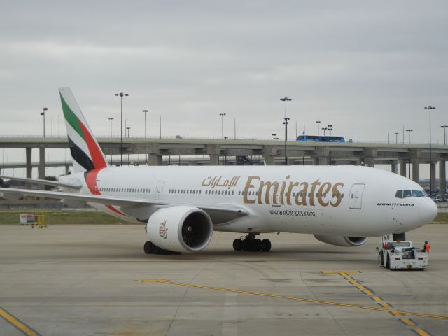 BOEING 777-200LR (A6-EWD) - Pushing back from gate D11 as Emirates EK222 nonstop to Dubai