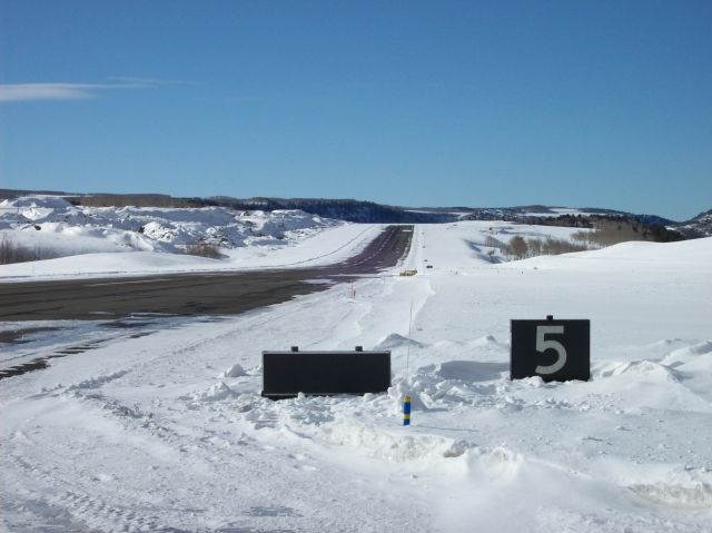 — — - Downhill?  Uphill?  Both!!!  Looking West down runway 27 at Telluride, CO.