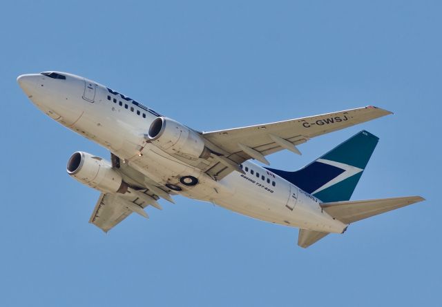 BOEING 737-600 (C-GWSJ) - The increasingly rare -600 series departing DFW for Calgary (Please view in full for best photo quality)