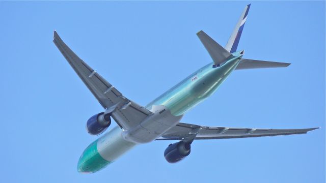 BOEING 777-300 (VP-BGD) - BOE333 climbs from runway 34L to begin its maiden flight on 2/23/13. (LN:1084 c/n 41681).