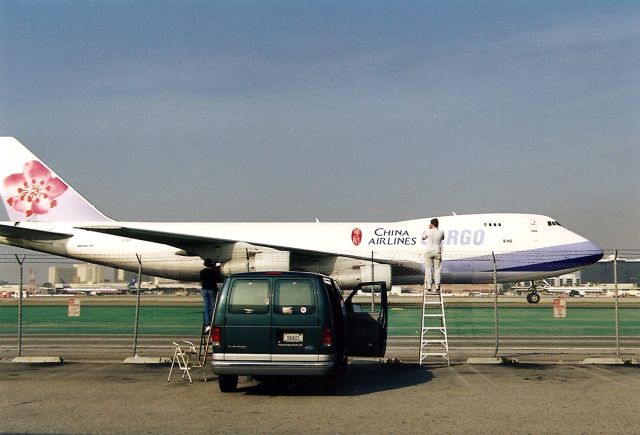 Boeing 747-200 (B160) - KLAX- back in the good ole days - when one could take ladders and stack em next to the fence. This lot was near Douglas Dr and the FedEx building. On the right is Mark Durbin his brother Mike Durbin was in my van, and Craig Curtis on the left...we used to film all day here and no worries- used 10 rolls of 36exp ASA 100 and had a blast, with dinner at Woodys BBQ steakhouse on S Sepulveda Blvd..this all before the Internet..but Imperial Terminal lot ruled all for PM photos. Photo date Jan 1998.