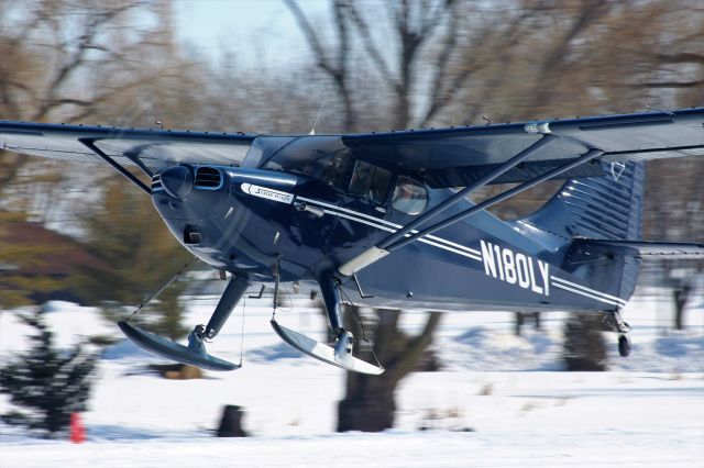 Piper 108 Voyager (N180LY) - A handsome Piper Stinson Voyager making its way in to the EAA Oshkosh Ski Plane Fly-In 2020.