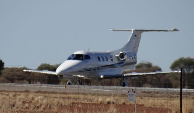 Embraer Phenom 100 (VH-LWZ) - Mirage shimmer at the threshold