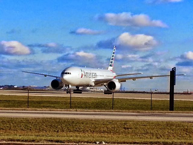 Boeing 777-200 (N7AE) - Parked on the hardstand out by the hangers at ORD.