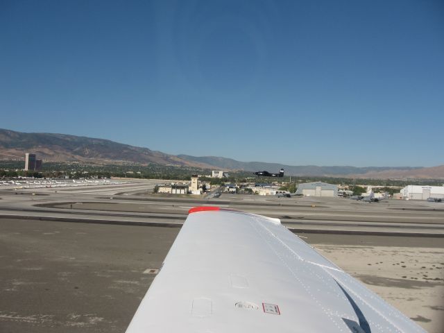 Mooney M-20 (N1029M) - parallel takeoff w A26 at Reno after air races 2007