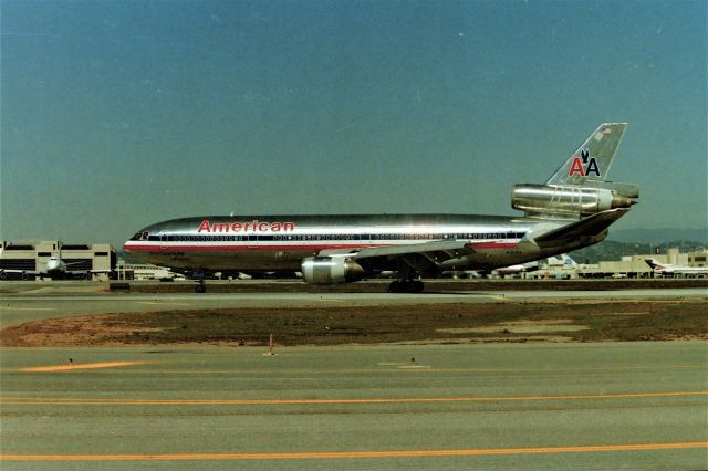 McDonnell Douglas DC-10 (N101AA) - KLAX - Imperial Terminal parking lot offered great views when I took this March 1989 - I was down in LAX for the LAX Airliner Collectible Show at the Hacienda Hotel when it was held there many moons ago hosted by Tim Williams and John Dekker. That was one great show - with the rumor always circulating to watch for John Travolta to show up and buy memorabilia for his Connie collection and his Boeing 707. I never believed the rumors but people I knew who would know and honestly told me, they confirmed that Travolta did attend the LAX show a few times with a bodyguard and did buy airline memorabilia from LAX sellers but didn't hang around when he was done buying. N101AA was CN: 46500 LN:1.