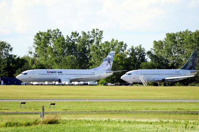 BOEING 737-400 (C-FFNC) - C-GNDF is in the foreground with engines removed.