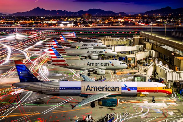 Airbus A321 (N582UW) - I haven’t posted on FlightAware in nearly two years, so I thought it’d be nice to go back to my roots and put up some of my best work from 2024 on here! If you enjoy my work, follow me @phxplanepics on Instagram!br /br /This photo needs extra context vs the others that I uploaded in this batch: I spent two years getting long exposure shots of all of AA's heritage A321s parked at gate B4 from the exact same spot in the Terminal 4 garage to be able to make this composite shot of one mega heritage plane!