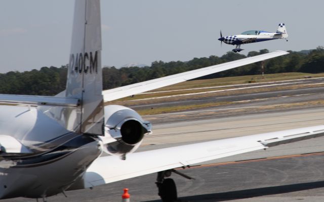 EXTRA EA-300 (N330TY) - After a series of practice stunts N330TY returns to KPDK, N240CM sits in the foreground.