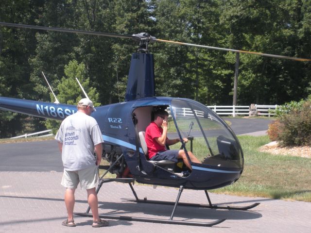 Robinson R-22 (N186SH) - Paul Salmon, CFII with Tim Brumitt in his driveway 2010