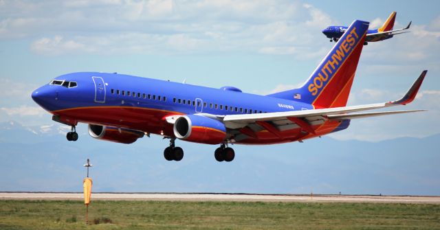 Boeing 737-700 (N446WN) - Arriving on 16L. Southwest 737 in the background is landing on 16R.