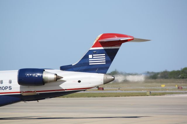 Canadair Regional Jet CRJ-700 (N710PS) - PSA Flight 2232 at the gate at Sarasota-Bradenton International Airport