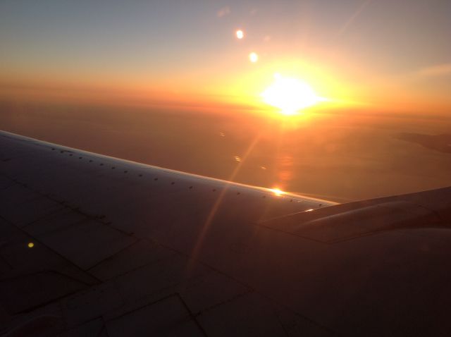 Boeing 737-700 — - Flying from SFO.  Sunset.