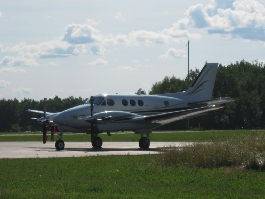 Beechcraft King Air 90 (N7230H) - Parked on the ramp at Belfast Municipal Airport (KBST).