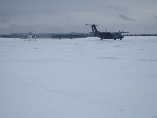 — — - Air Labrador being followed by Provincial Airlines Dash 8 to Terminal at Goose Airport NL, April 15/09