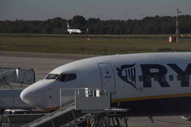 Boeing 737-700 — - One Ryanair aircraft is stationary, the other plane is movement, at Eindhoven Airport (Holland). (Saturday, October 13th, 2018).