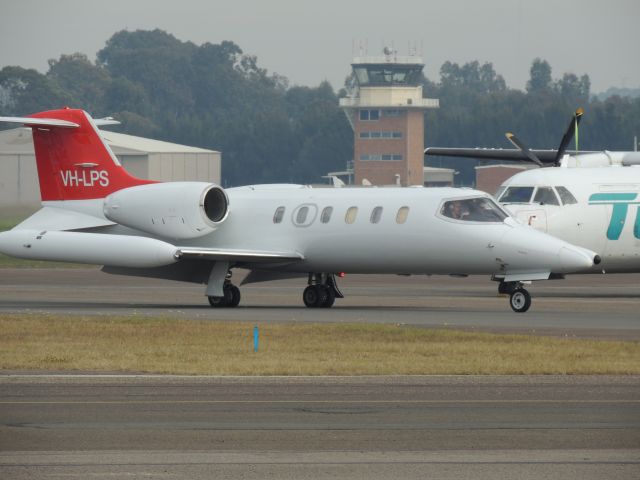 Learjet 35 (VH-LPS) - i was at Bankstown airport waiting for a departure of a cirrus vison jet when out of the blue this amazing Learjet 35A camera taken on : cool pix P510 