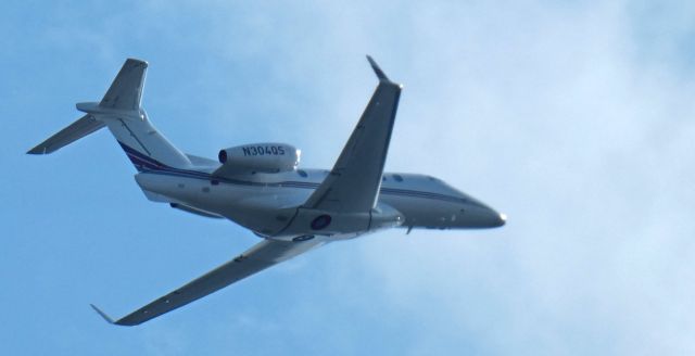 Embraer Phenom 300 (N304QS) - Shortly after departure is this 2013 Embraer Phenom 300 from the Summer of 2024.