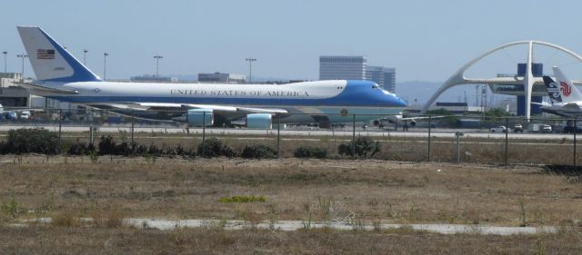 Boeing 747-200 (29000) - From a distance...  Tail #29000 about to commence take off roll from LAX