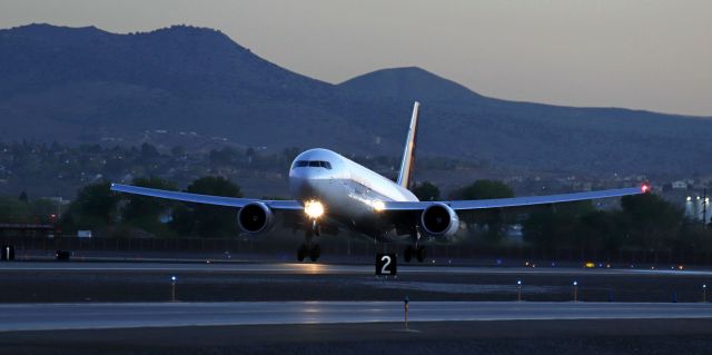 BOEING 767-300 — - The sun has not yet popped up over the Virginia Range east of the airport as this UPS B763 flares out to put the mains down on 16L to complete its early dawn arrival (5:45 AM) from Sacramento (KMHR).