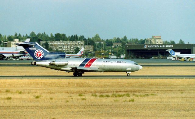 Boeing 727-100 (N934FT) - KSEA - Mid 1980s at the best airpark on the west coast at that time, Rare for me to see a Flying Tigers 727 let alone landing. I saw this jet in 1989 at LAX but the titles had been removed and was parked on the Cargo ramp on the South Complex next to 25L. LN 366.