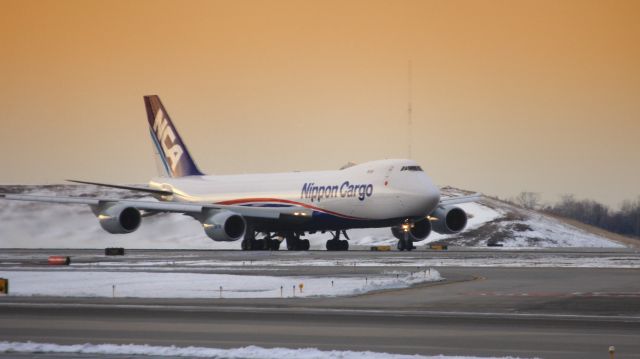 BOEING 747-8 (JA16KZ) - The NCA 747-8F took off on runway 10L at Chicago OHare International Airport (ICAO: KORD) in the beautiful sunsnet on 03/24/2015.