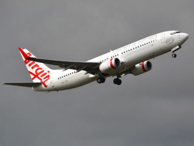 Boeing 737-800 (VH-YID) - Getting airborne off runway 23 on a gloomy, cold winters day. Wednesday 4th July 2012.