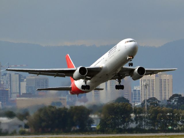 BOEING 767-300 (VH-ZXF) - Getting airborne off runway 23 on a cold, gloomy winters day. Wednesday 4th July 2012.