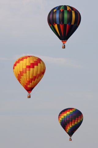 Unknown/Generic Balloon (N51417) - An Aerostar Intl. RX7, (Benevolence) lifting off above N625DH (Sunshine Fellowship) and N157MC (Jabberwocky) as seen while passing through Rossford, OH looking south from the Ohio Turnpike (near mile marker 65) on Sunday morning, 15 Jul 2018. Nineteen balloons competed in the 3rd annual Glass City Balloon Race in Rossford, OH.